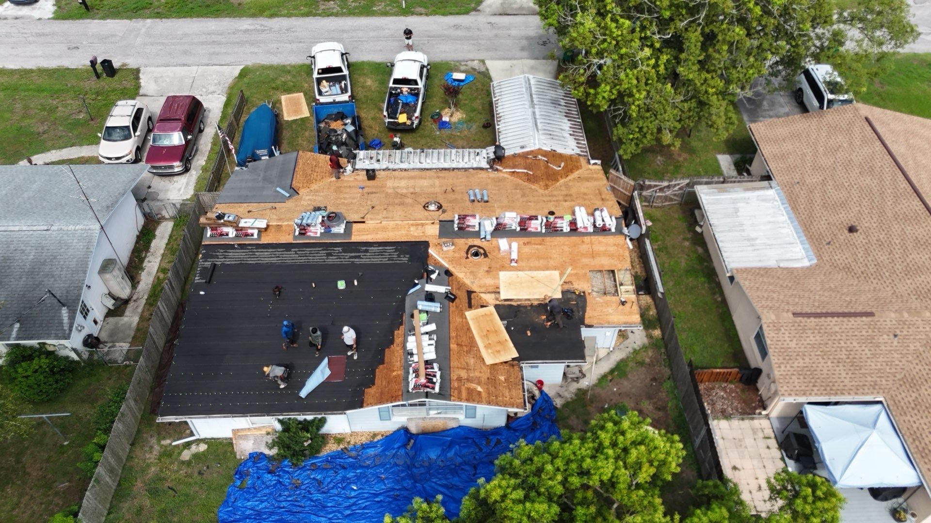 Crew drying in the roof deck with new plywood sheets in Zephyrhills FL