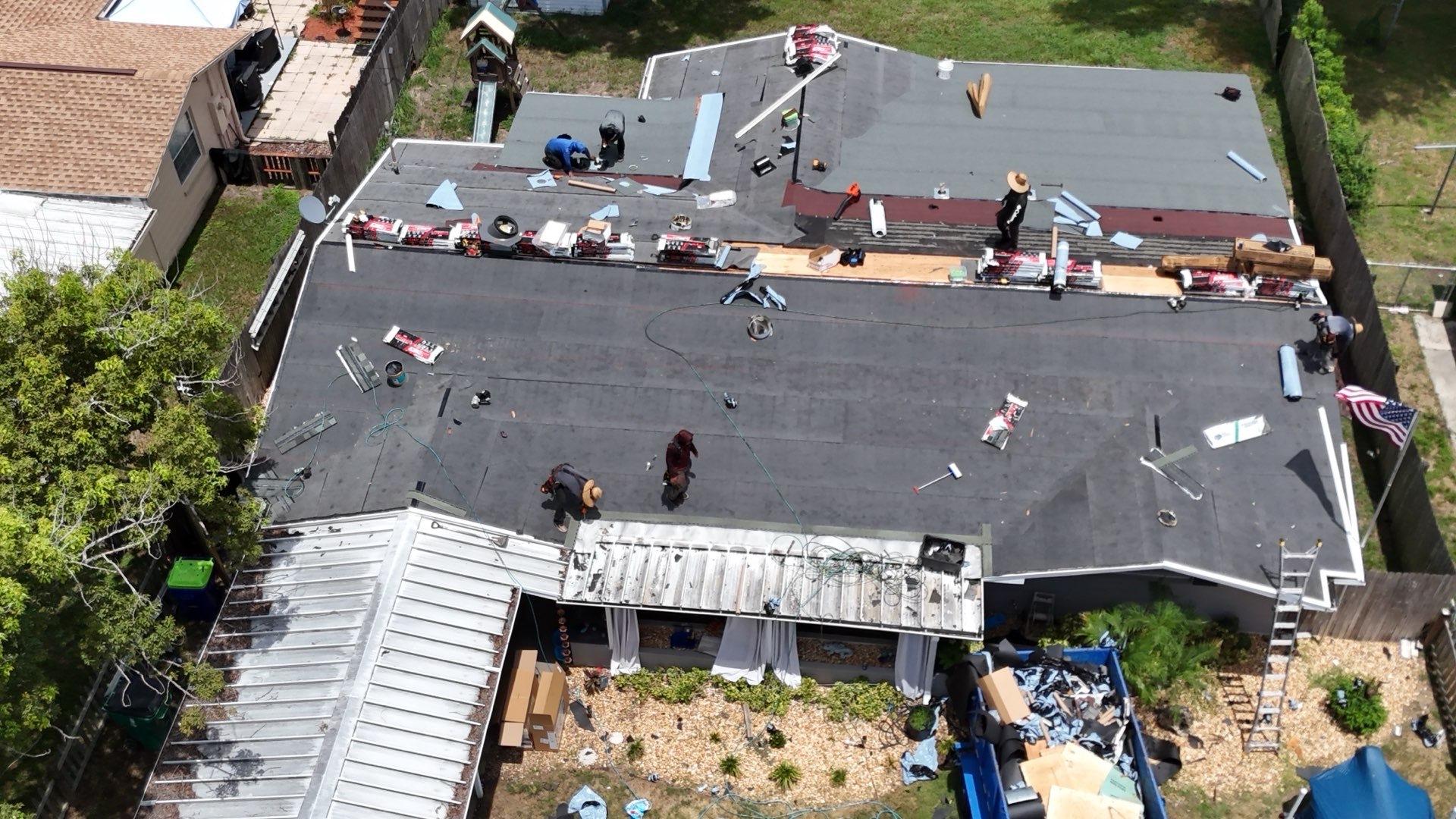 Modified bitumen going down on the low-slope section of a Zephyrhills FL roof