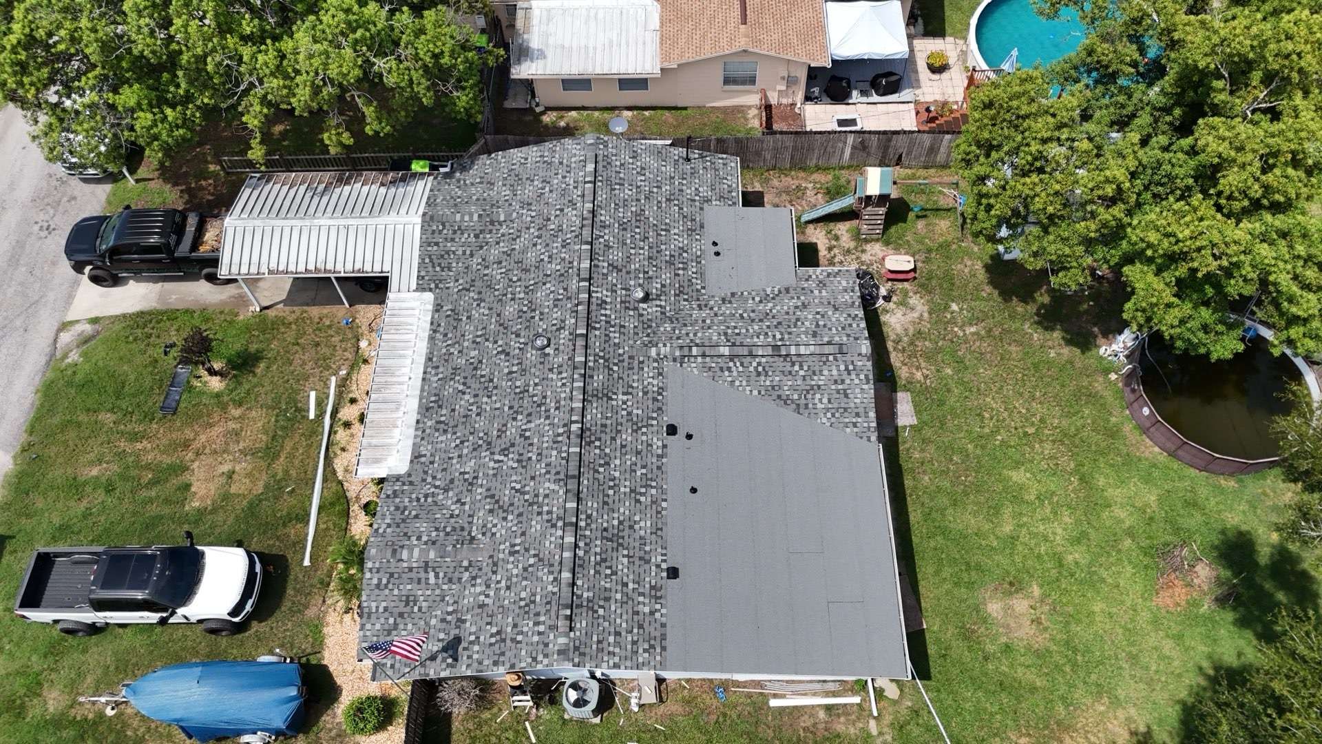 Aerial view of the finished shingle and low-slope roof in Zephyrhills FL
