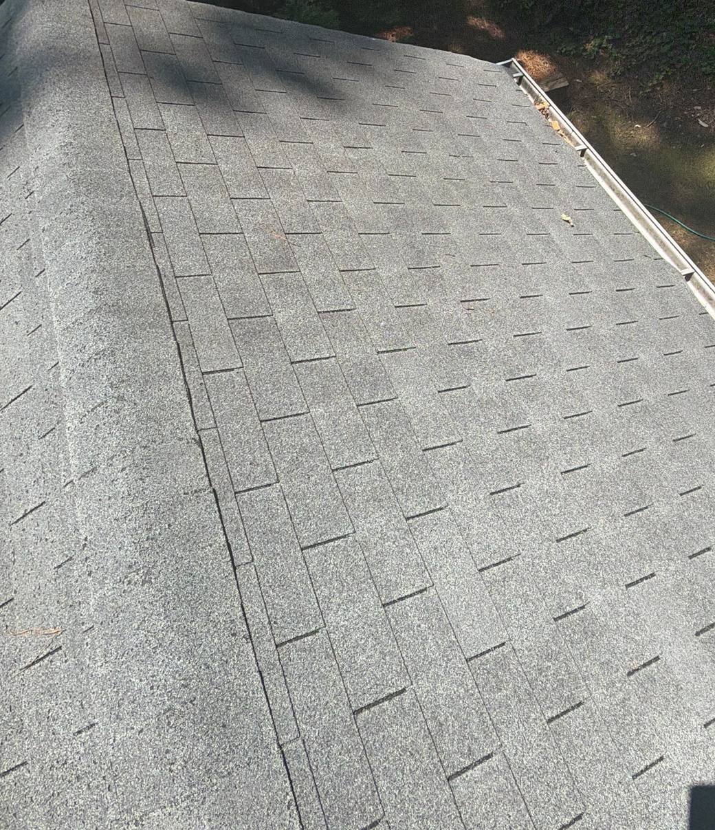 Worn, faded shingles on the old roof in Roswell GA