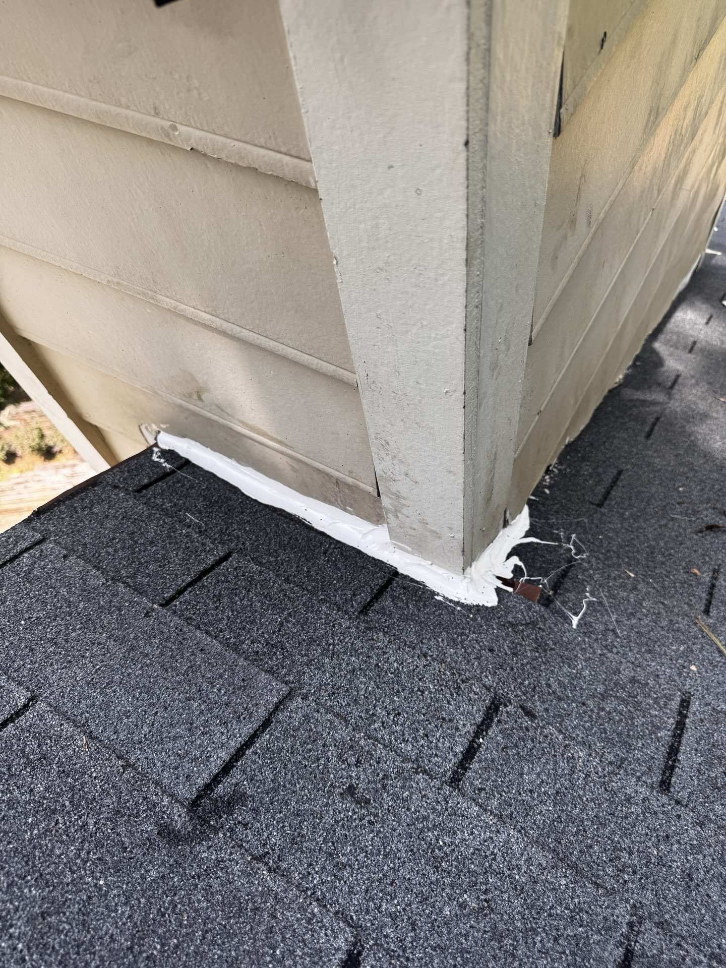 Caulk used in place of flashing where the roof meets a wall corner in Roswell GA