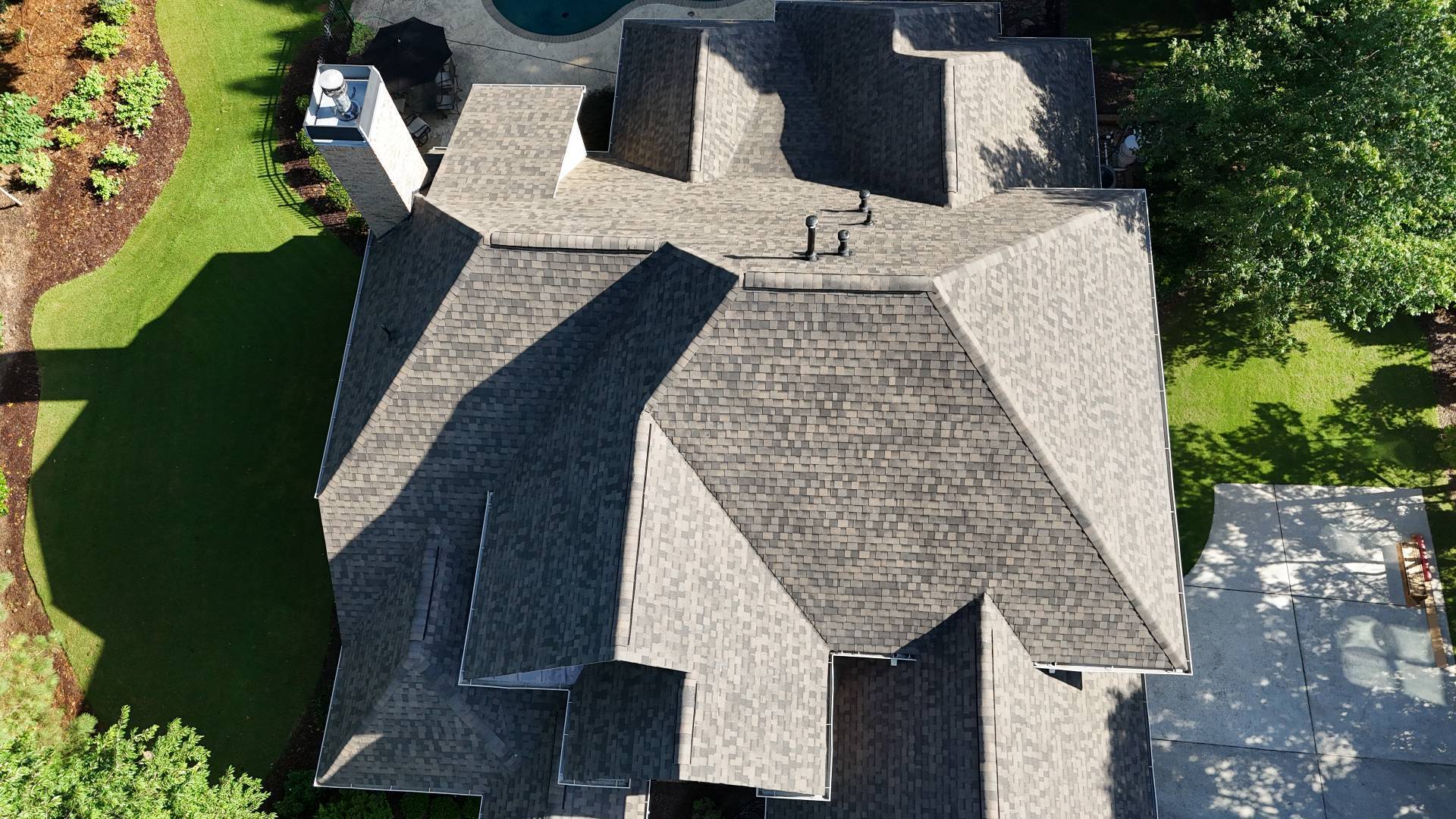 Top-down drone view of the finished IKO Dynasty shingle roof in Suwanee GA