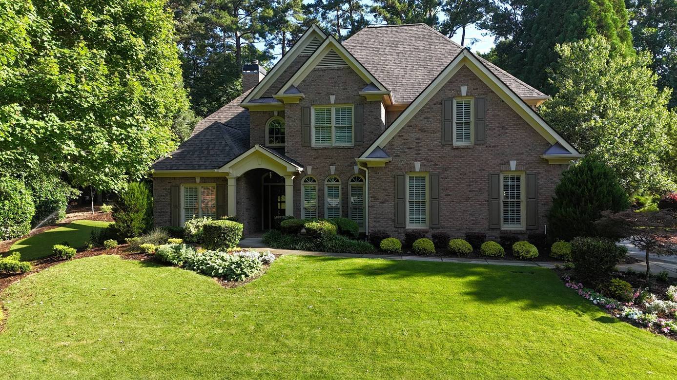 Front of the brick home in Suwanee GA with its new architectural shingle roof