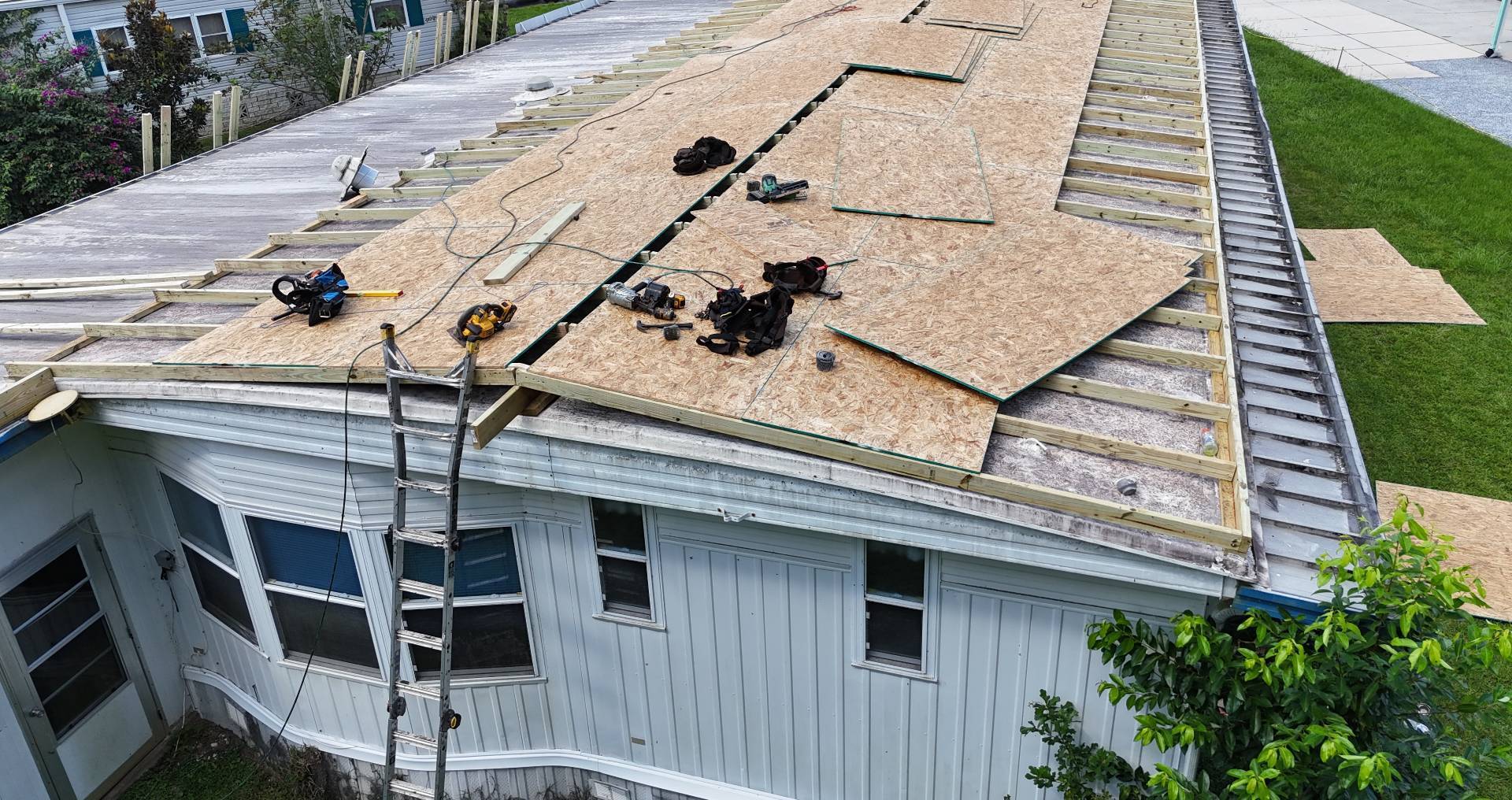 New 2x4 framing and OSB decking going down on a manufactured home roof in Dade City FL