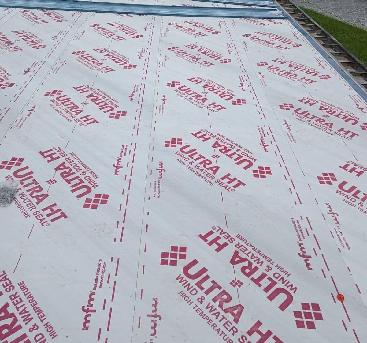 High-temperature ice and water shield over the new deck with metal panels staged in Dade City FL