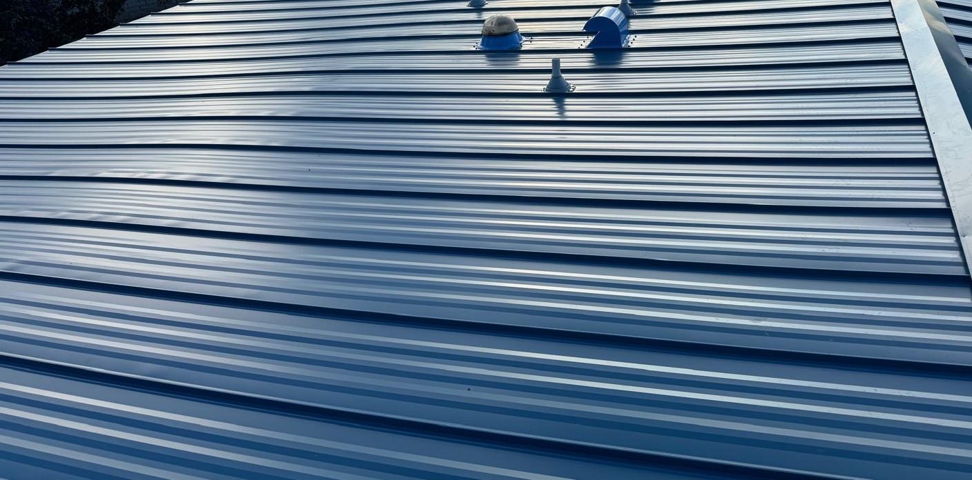New pipe boots and vents in the standing seam metal roof in Dade City FL