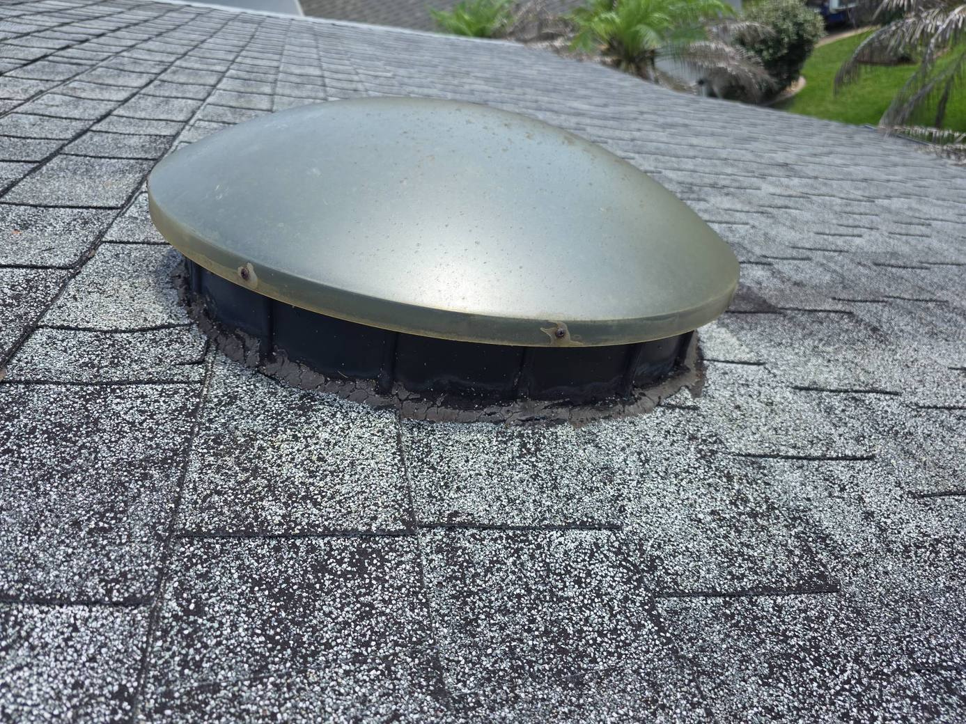 Cracked sealant around an old solar tube dome in Port Orange FL