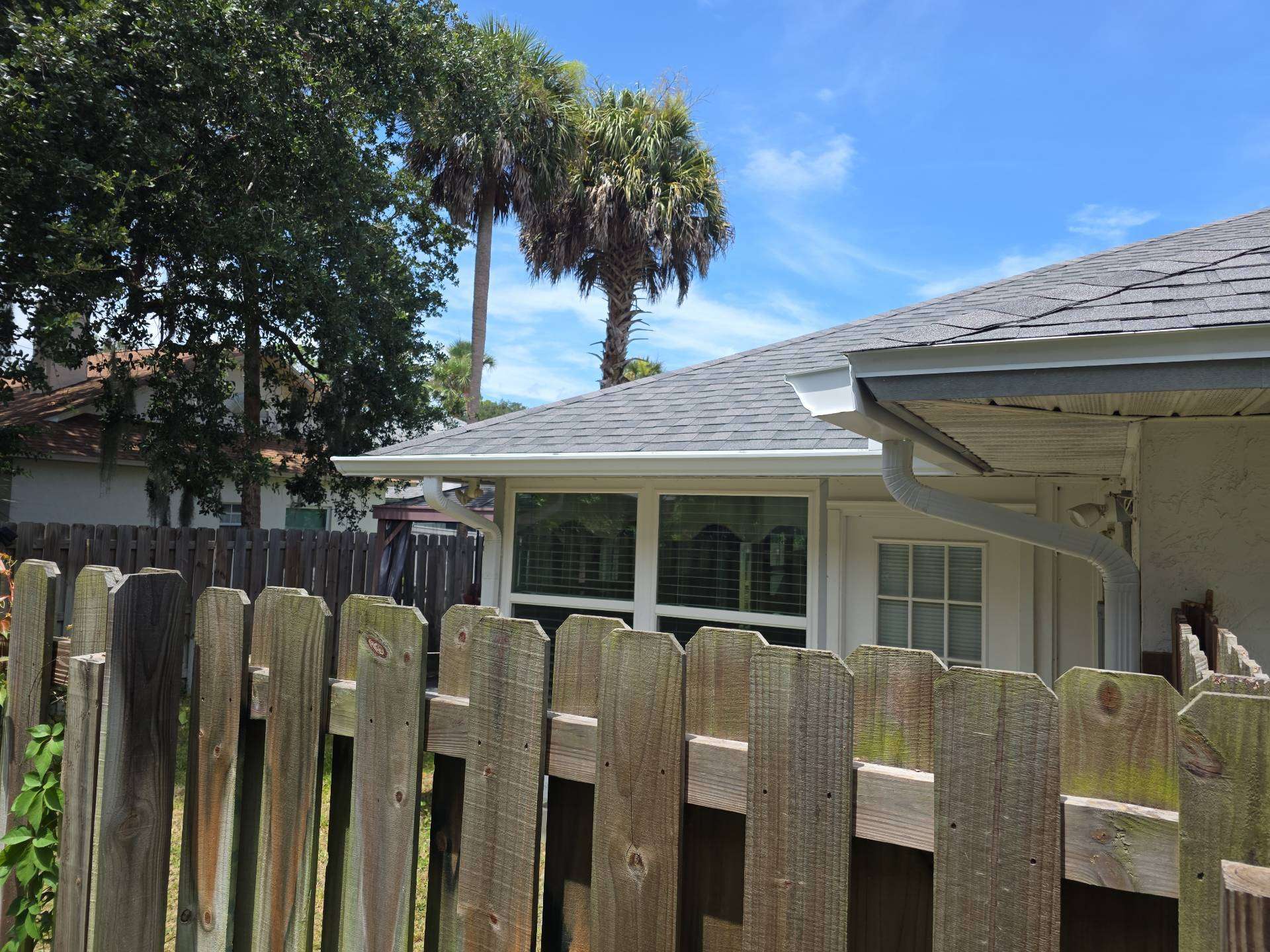 New shingles and white seamless gutters at the back of the Port Orange FL home