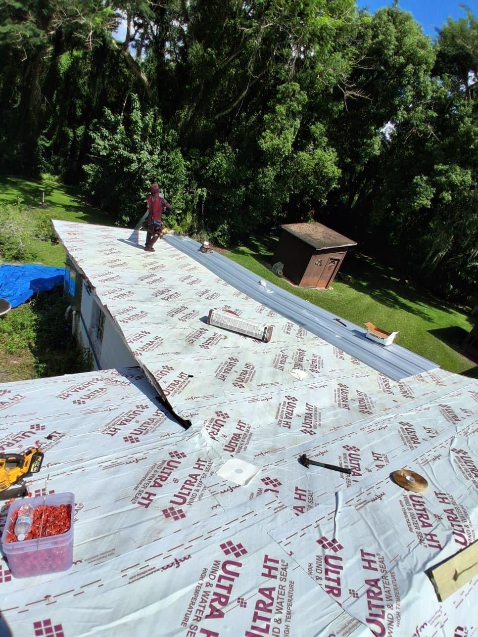 High-temperature ice and water shield over the deck with the first metal panels going on in DeBary FL