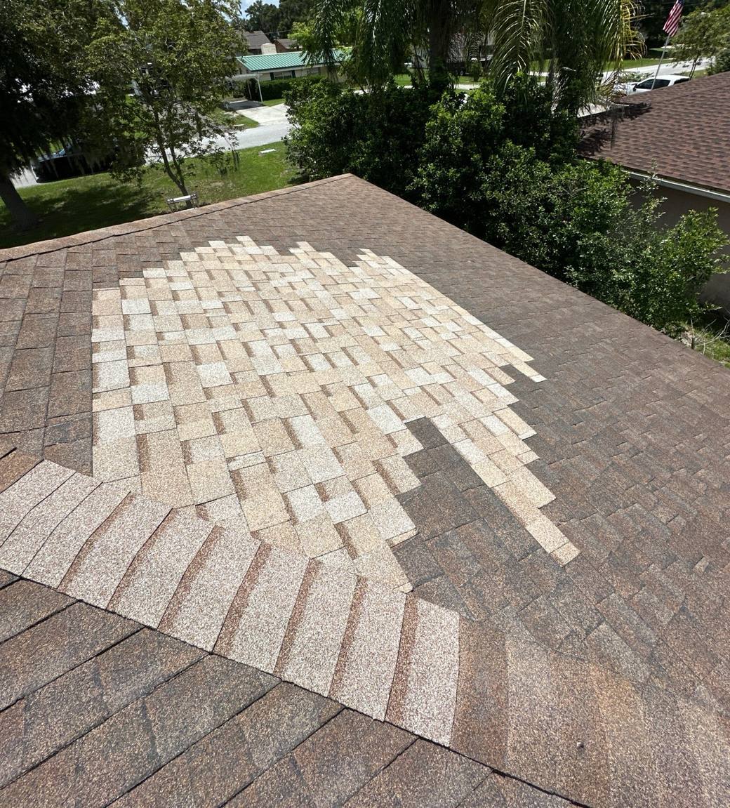 Old shingle roof with many mismatched patch shingles in Lake Wales FL