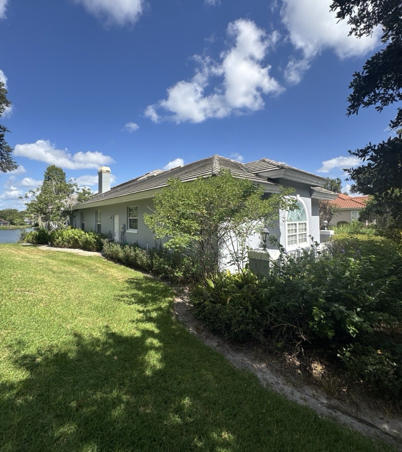Old tile roof on a lakefront home in Lakeland FL