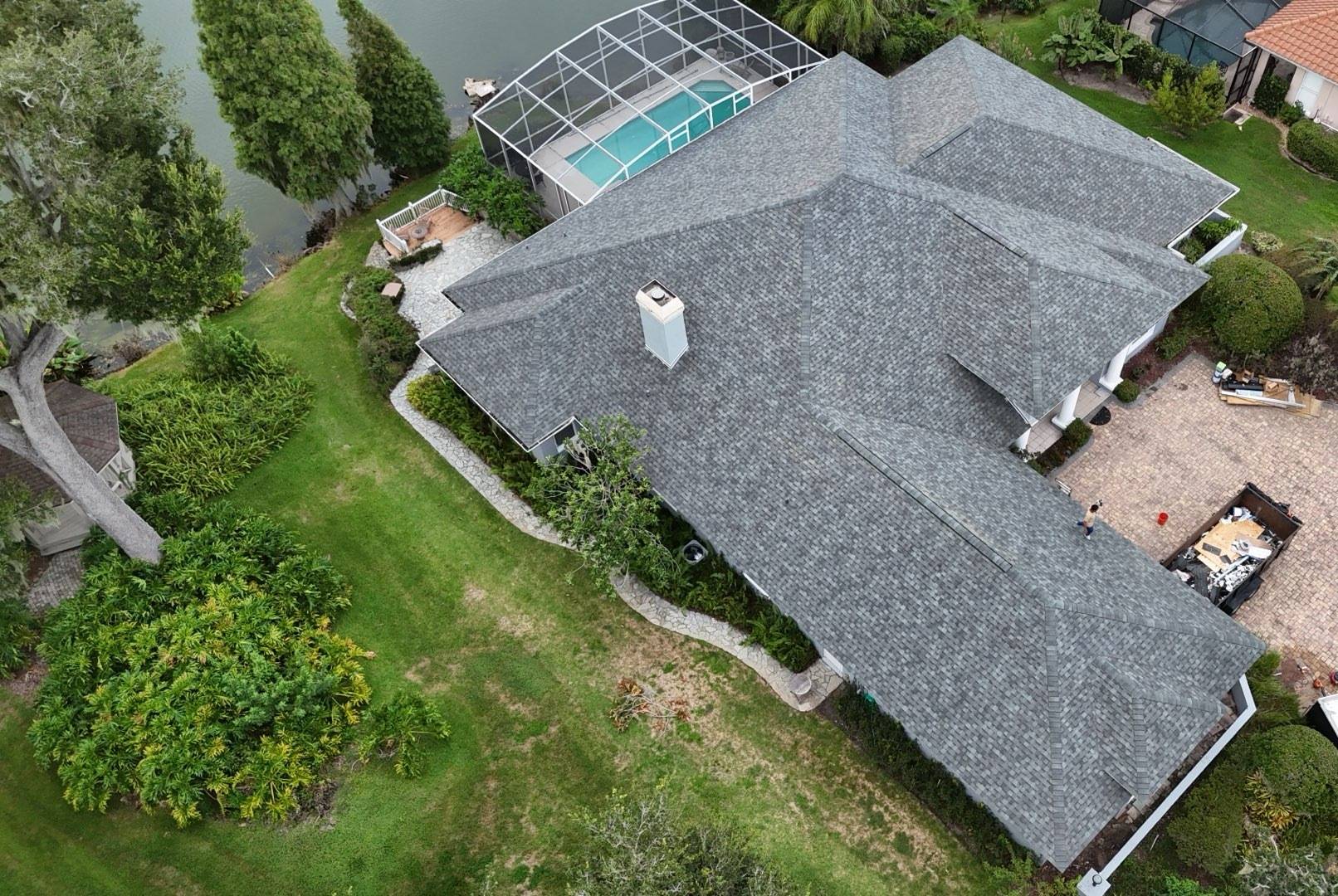 Drone view of the new Titan XT shingle roof and pool cage in Lakeland FL