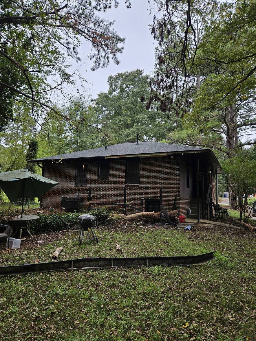 Back of the brick home in Atlanta GA with its new shingle roof